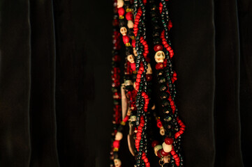 black and red guide cord with skulls, umbanda, a Brazilian religion of African origin