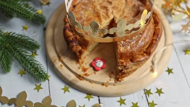 Golden crown with royal galette on the table.