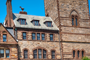 Section of an old building in Boston, Massachusetts, USA. Sunny summer day and blue sky in background.
