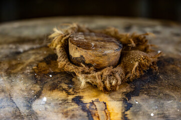 Aging process of cognac spirit in old dark French oak barrels in cellar in distillery house, Cognac...