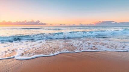Obraz premium Foamy Ocean Wave Crashing on Sandy Beach at Sunrise
