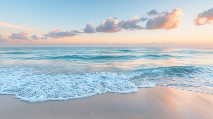 Fototapeta premium Tranquil Ocean Waves Crashing on Sandy Beach at Sunset