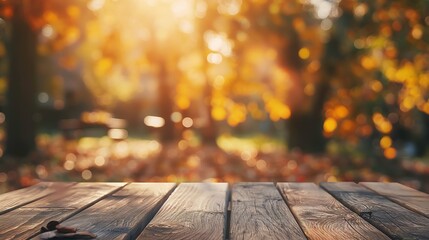 A wooden table in a sunlit forest with blurred autumn foliage in the background.