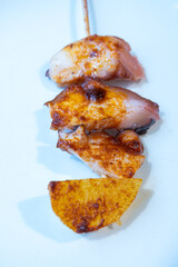 Typical snacks of Basque Country, pinchos or pinxtos skewers with small pieces of bread, fish, sea food, sweet green pepper served in bar in San-Sebastian or Bilbao, Spain