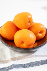 Bowl with red ripe sweet apricots fruits, harvest in Vaucluse, Provence, France