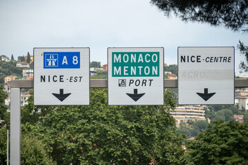 Fototapeta premium Driving car or camper on free on Cote d'azur, French Riviera in summer, road signs and directions, traffic jam on touristic road in France