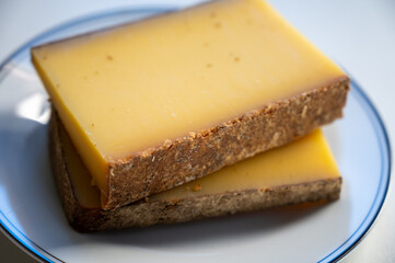 French cheese Comte, varieties unpasteurised ed milk Prestige, fruity flavoured Fruite and Vieille Reserve close up