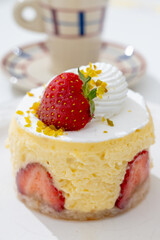 Red fruit sweet dessert cheesecake tart with fresh strawberries in bakery