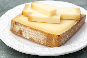 French cheese Comte, varieties unpasteurised ed milk Prestige, fruity flavoured Fruite and Vieille Reserve close up