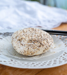 French fresh white soft goat cheeses with topping made with black pepper