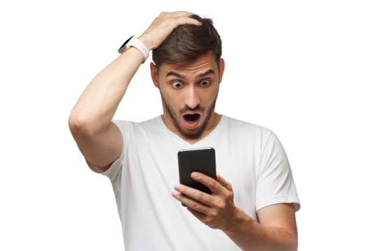 Close-up portrait of young guy in white t-shirt holding phone and looking at screen with troubled confused face, touching head