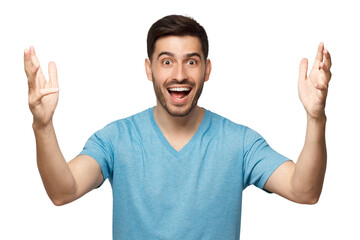 Young happy man in blue t-shirt holding hands open feeling excited and amazed by his success, screaming with joy