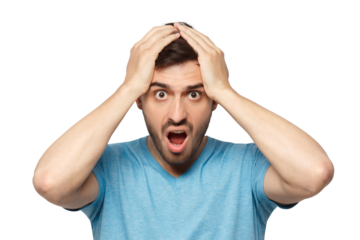 Shock content. Surprised young man in blue t-shirt shouting, holding his head with both hands