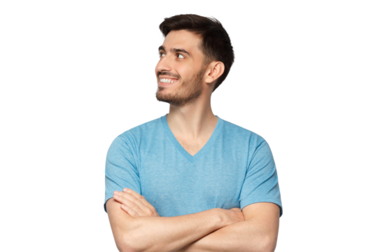 Young handsome man in blue t-shirt, standing with crossed arms, feeling confident, looking away