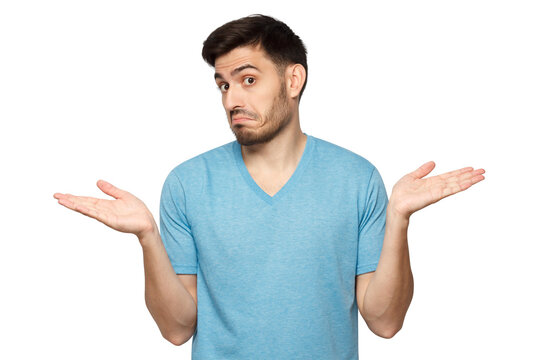 I don't know. Portrait of young confused man in blue t-shirt standing and shrugging shoulders, spreading hands