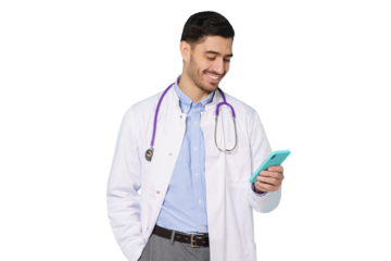 Young handsome doctor standing in white coat smiling while looking at screen of his phone, using medical app