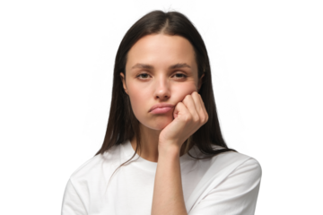 Young woman pressing hand to chin, looking bored, exhausted and disappointed, feeling helpless and upset