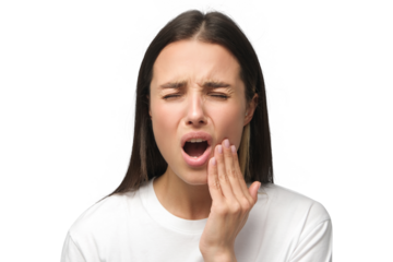 Toothache. Studio shot of young woman feeling pain, holding her cheek with hand, suffering from bad tooth ache