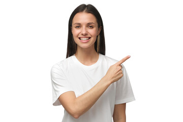 Smiling young woman in white t-shirt pointing right with index finger