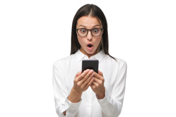 Young woman with shocked face staring at screen of her phone, dressed in white shirt
