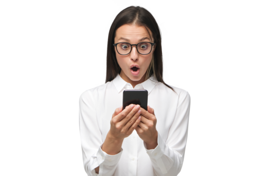Young woman with shocked face staring at screen of her phone, dressed in white shirt