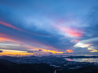 aerial view Horizon panorama mountain and dramatic twilight sky and cloud sunrise background..Twinkling lights along the beach and in various towns around Phuket Island. .lighting background..
