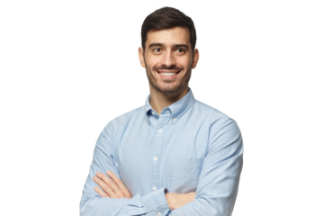 Handsome smiling businessman in blue shirt standing with crossed arms