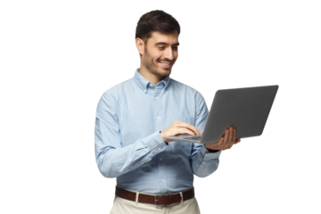 Young handsome businessman standing, holding laptop with happy smile and typing