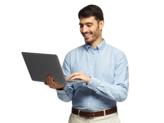 Young businessman using laptop, laughing, standing and smiling