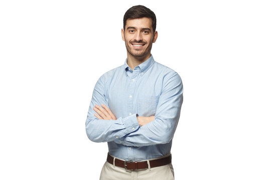 Handsome smiling businessman in blue shirt standing with arms crossed