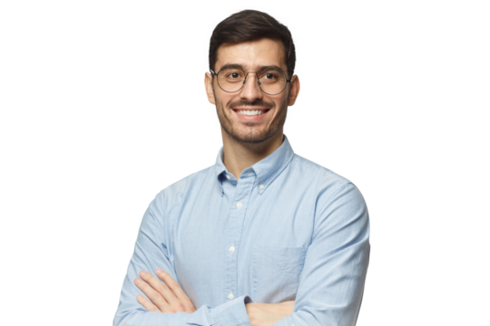 Handsome smiling businessman in blue shirt standing with crossed arms