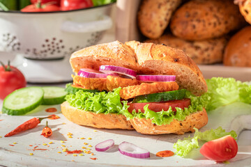 Fresh and tasty sandwich with curry chicken and lettuce.