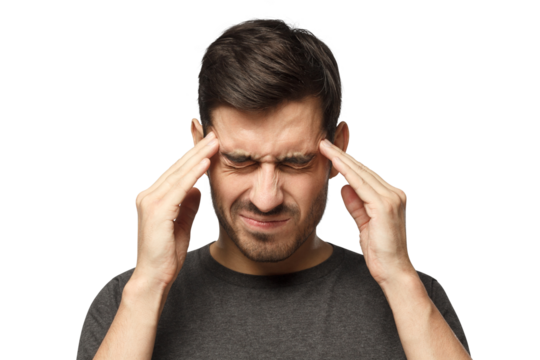 Portrait of young man suffering from severe headache, pressing fingers to temples with closed eyes