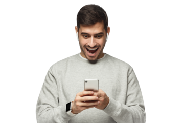 Young shocked excited man looking at his phone with surprise expression