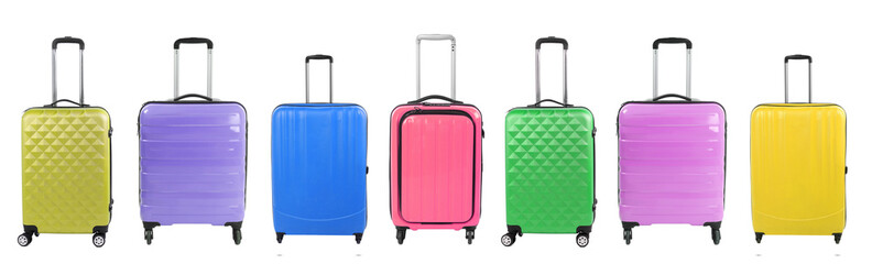 Stylish suitcases of different colors on white background, set