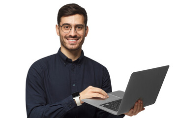 Young confident business man in deep blue shirt holding laptop and smiling at camera, isolated on gray background