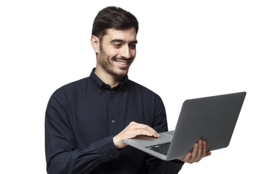 Young modern businessman standing, holding laptop with happy smile