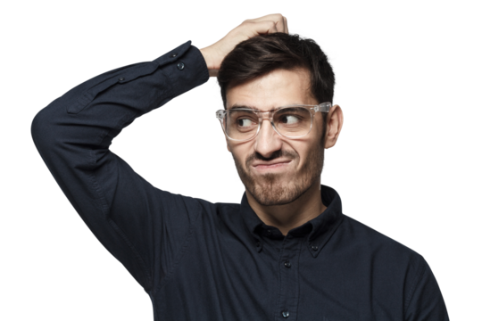 Young thoughtful businessman thinking, scratching his head trying to find solution