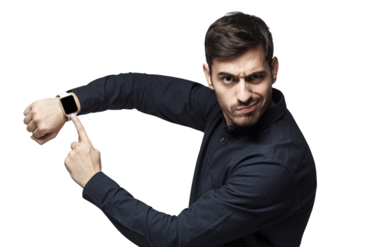 Young man pointing at watch with impatience as if asking to hurry up