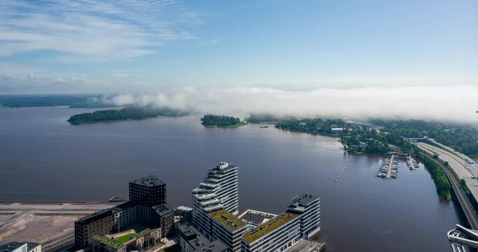 Timelapse of fog moving over sea and East Helsinki, sunny, summer day in Finland