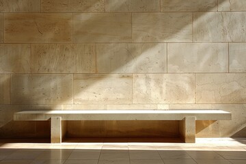 Minimalist sunlit textured stone wall and matching stone bench