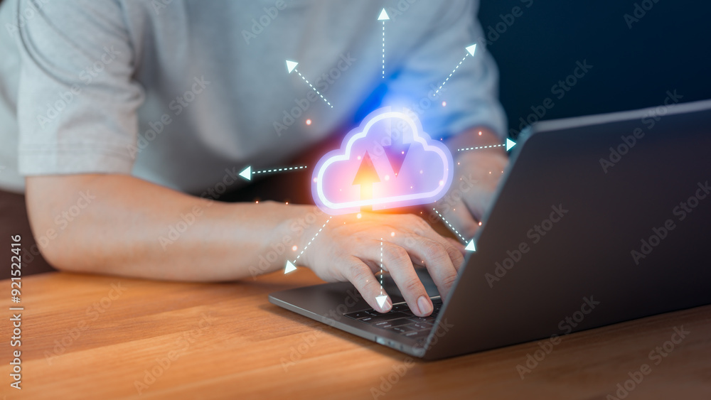 Poster young man working and focus with cloud technology graphics on a laptop at a home workspace.