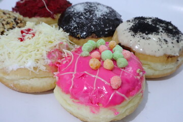 Colorful donuts isolated on white background