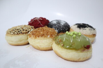 Colorful donuts isolated on white background