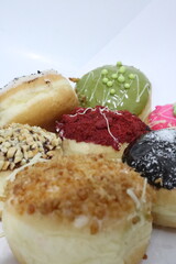 Colorful donuts isolated on white background