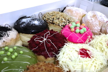 Colorful donuts with a lot of topping