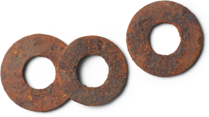 old corroded flat metal washers isolated white background, circular metallic discs with hole in center exposed to moisture or environmental condition 