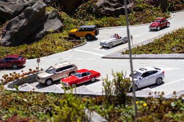 Parking lot with miniature and toy cars.