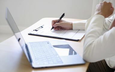 Business woman employer holding resume hiring recruit looking cv resume to hire candidates, analyzing information before job interview. Recruitment concepts