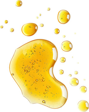 Golden oil droplets on a black background. The drops are scattered and appear to be floating on the surface.